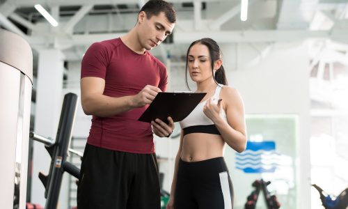 Woman Talking to Fitness Coach
